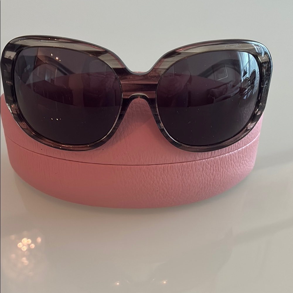 Juicy grey and black sunglasses.